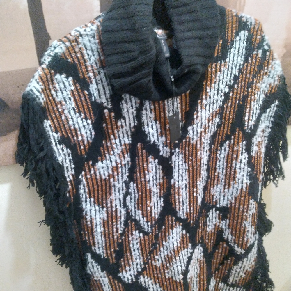 Women's turtle neck cashmere poncho.